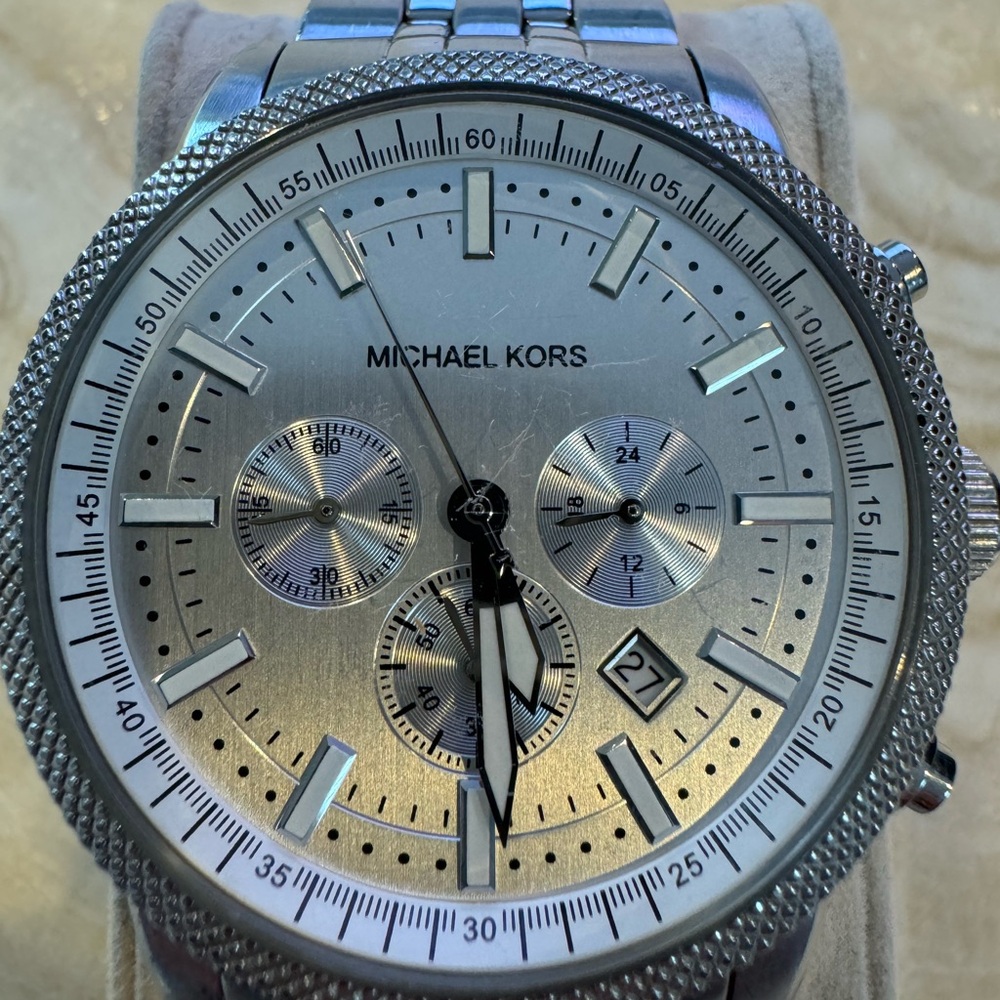 One men’s silver Michael Kors watch
